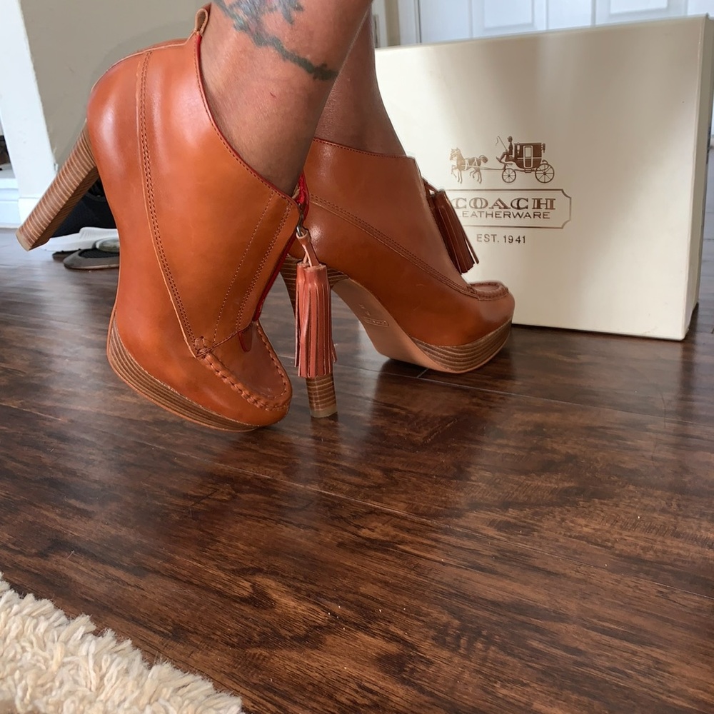 Coach heel with tassels. Never worn still in original box.